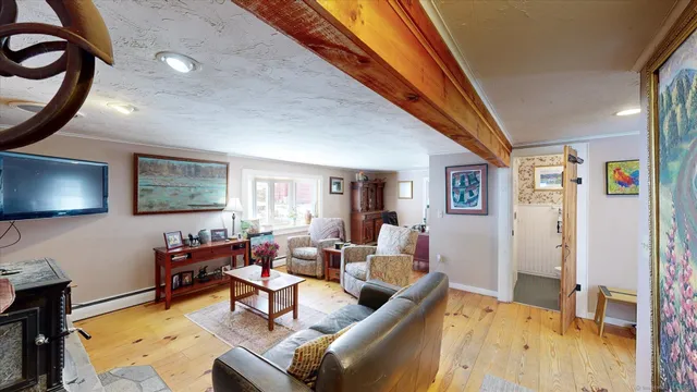a view of a livingroom with furniture and staircase