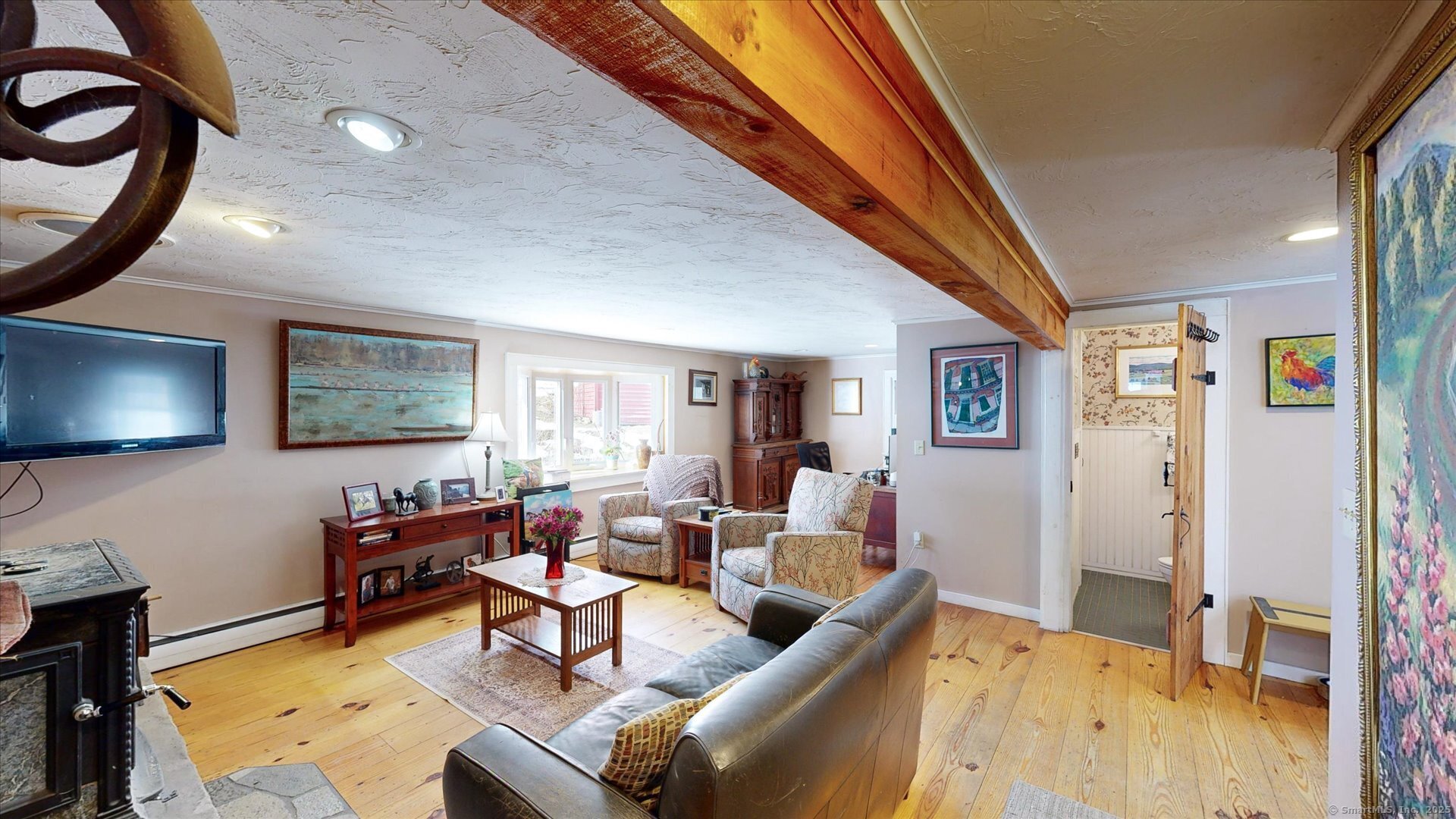 69 North Bedlam Road Chaplin, CT 06235 - Photo 16 of 40 a living room with furniture and a flat screen tv