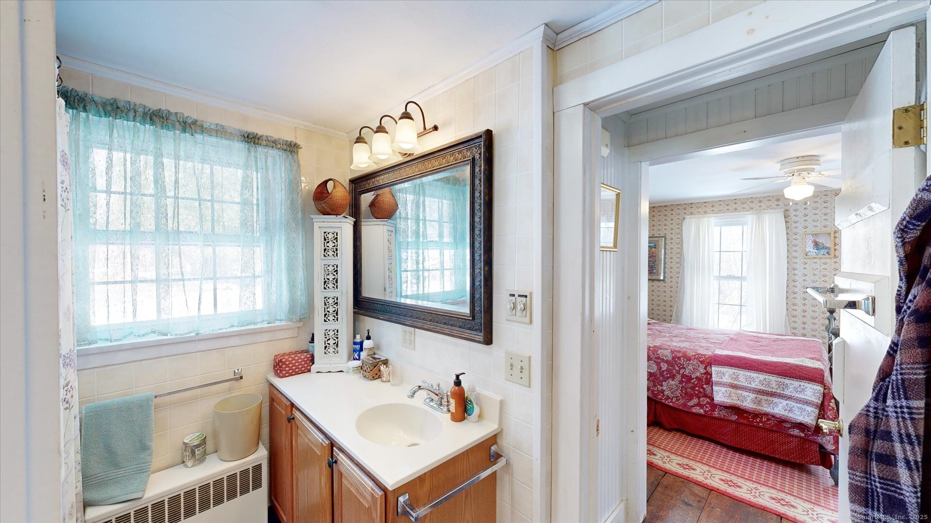 69 North Bedlam Road Chaplin, CT 06235 - Photo 25 of 40 a en suite bathroom with a sink and a mirror