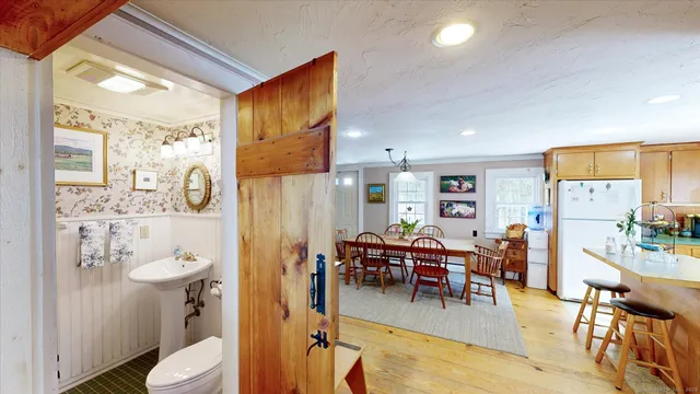 a view of a dining room with furniture and window