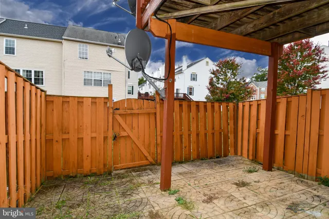 a view of a door with a wooden fence