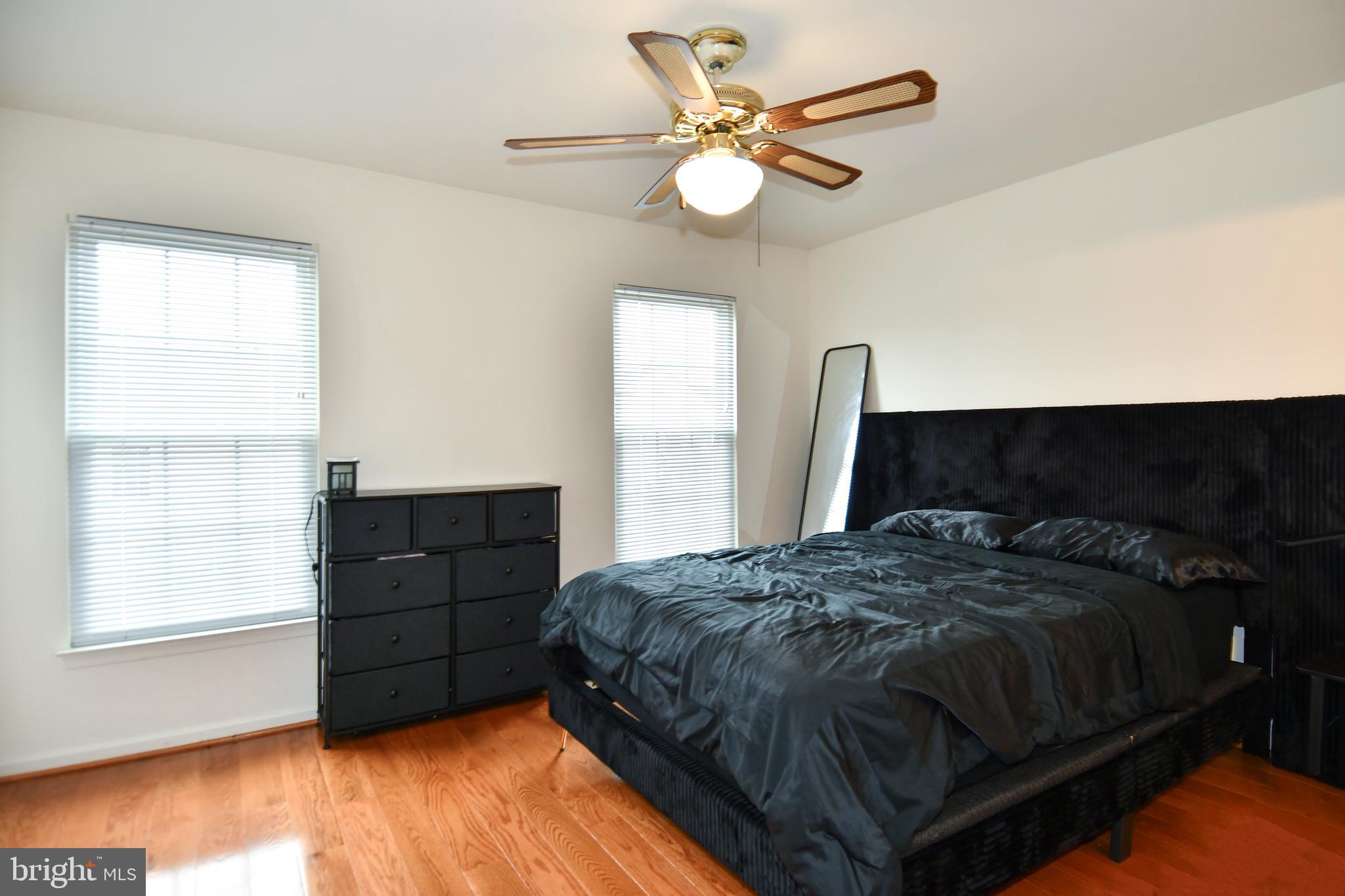 6410 Andrew Matthew Terrace Springfield, VA 22150 - Photo 15 of 31 a bedroom with a bed dresser and a window