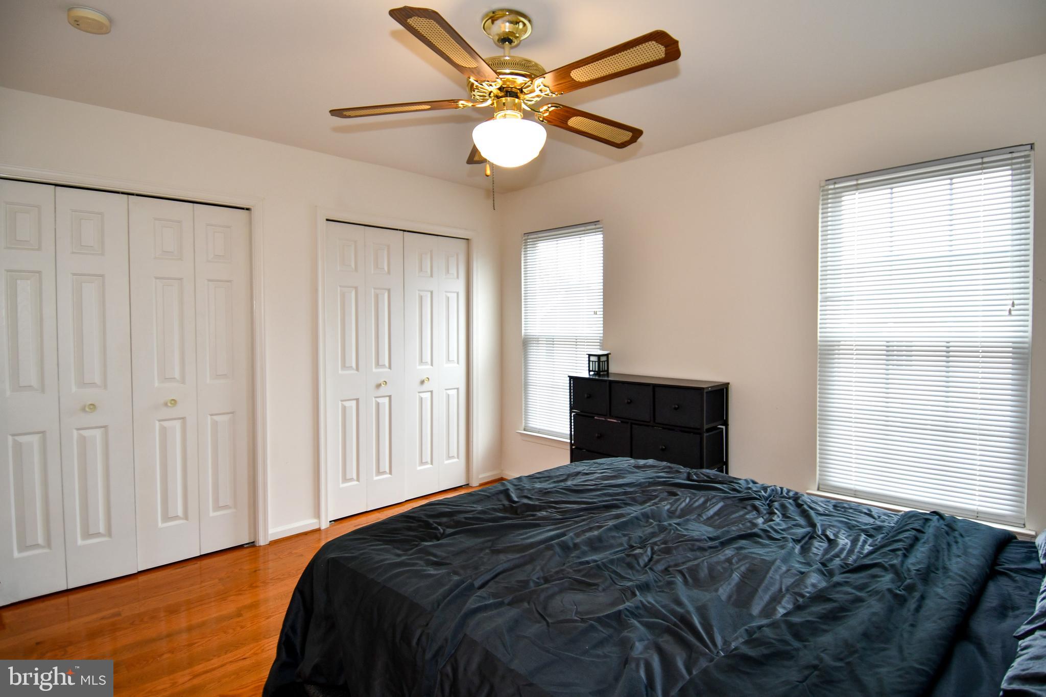 6410 Andrew Matthew Terrace Springfield, VA 22150 - Photo 17 of 31 a bedroom with a bed and a chandelier
