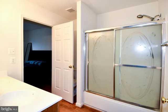 a room with a bed and a window