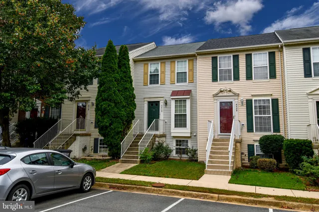 a view of a parked cars in front of a building