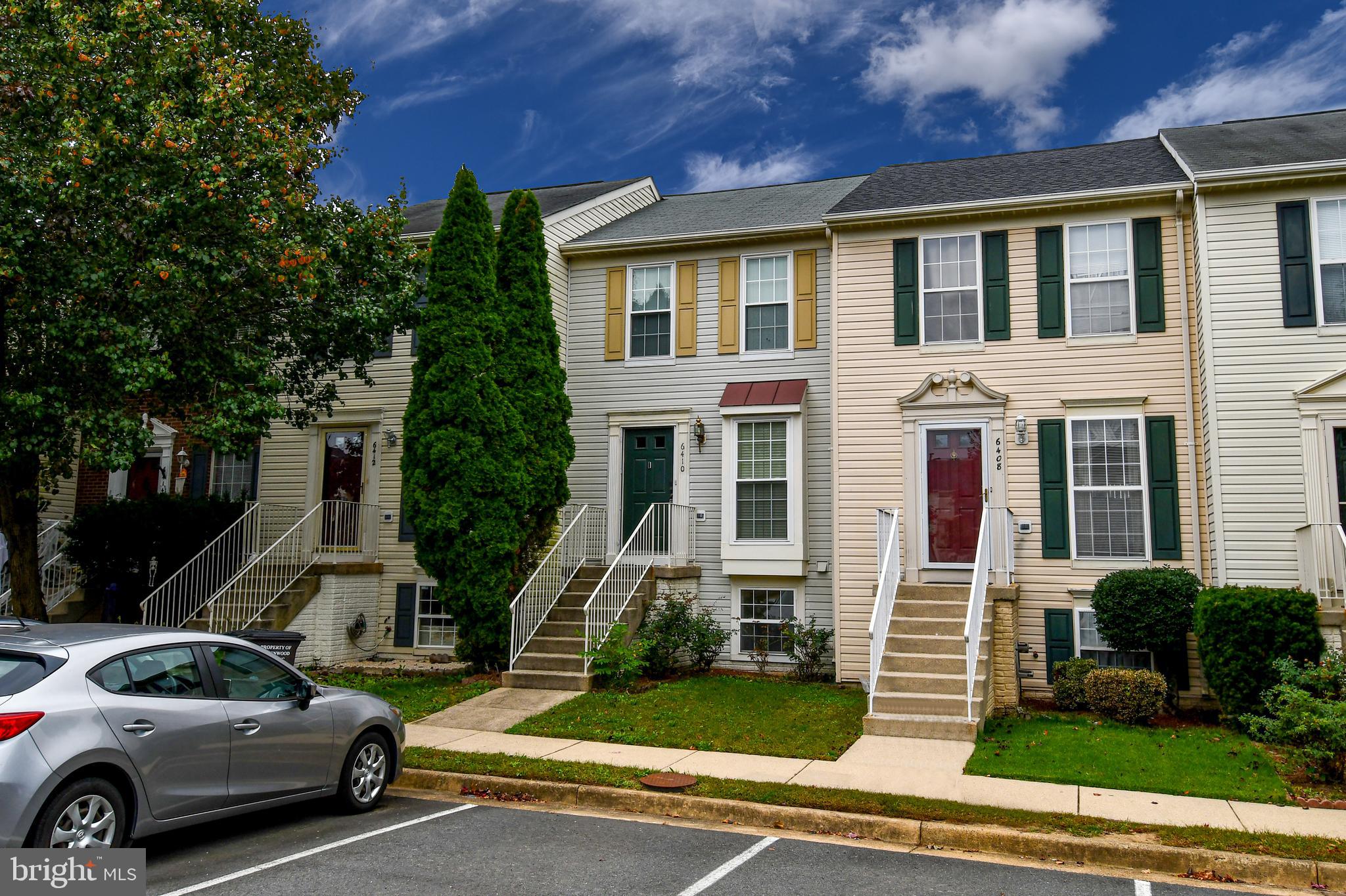 6410 Andrew Matthew Terrace Springfield, VA 22150 - Photo 2 of 31 a view of a parked cars in front of a building