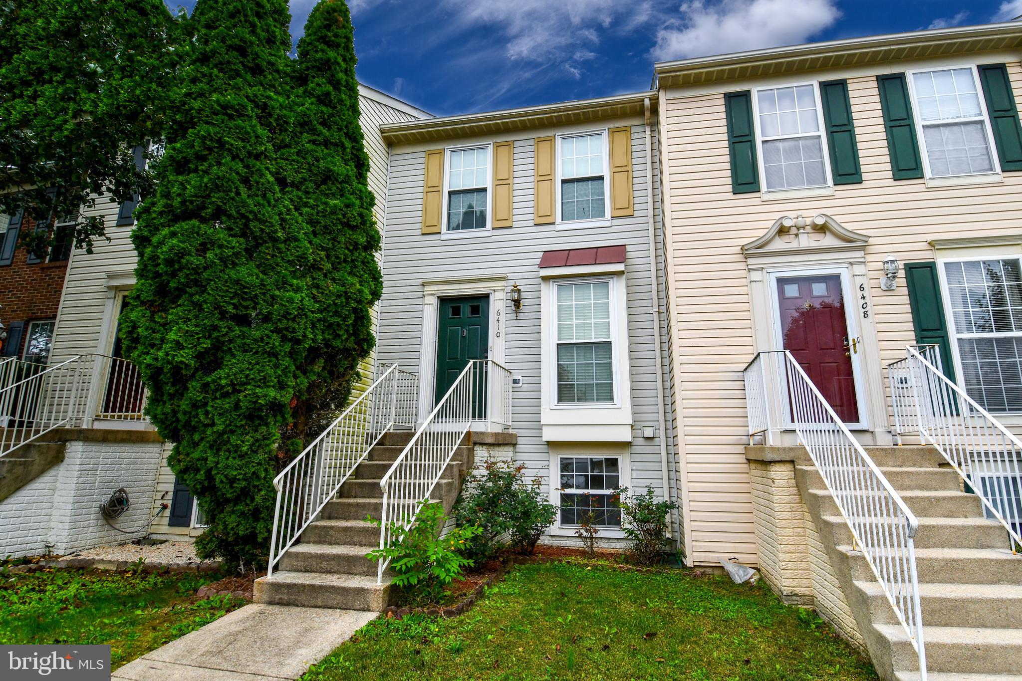 6410 Andrew Matthew Terrace Springfield, VA 22150 - Photo 3 of 31 a front view of a house with a yard