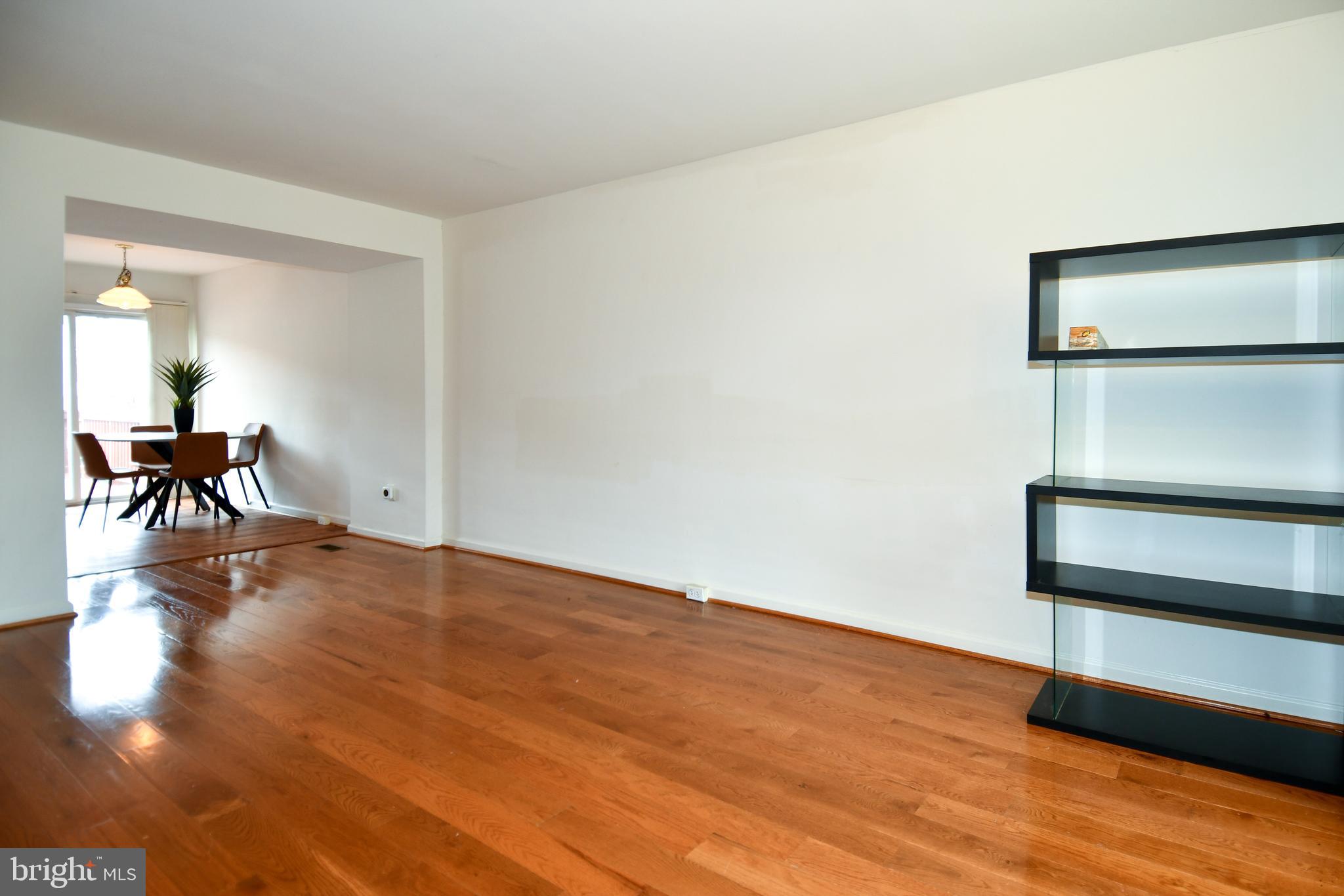6410 Andrew Matthew Terrace Springfield, VA 22150 - Photo 6 of 31 a view of a livingroom with wooden floor
