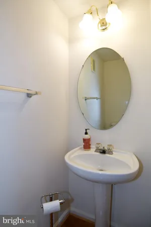 a bathroom with a sink and mirror