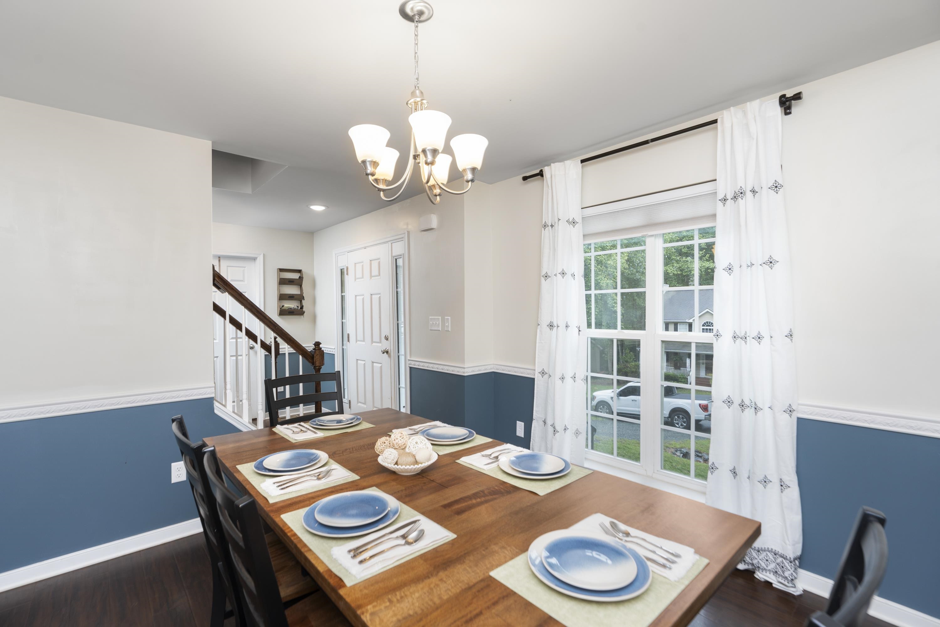 10 Zephyr Road Palmyra, VA 22963 - Photo 24 of 72 a view of a dining room with furniture wooden floor and chandelier