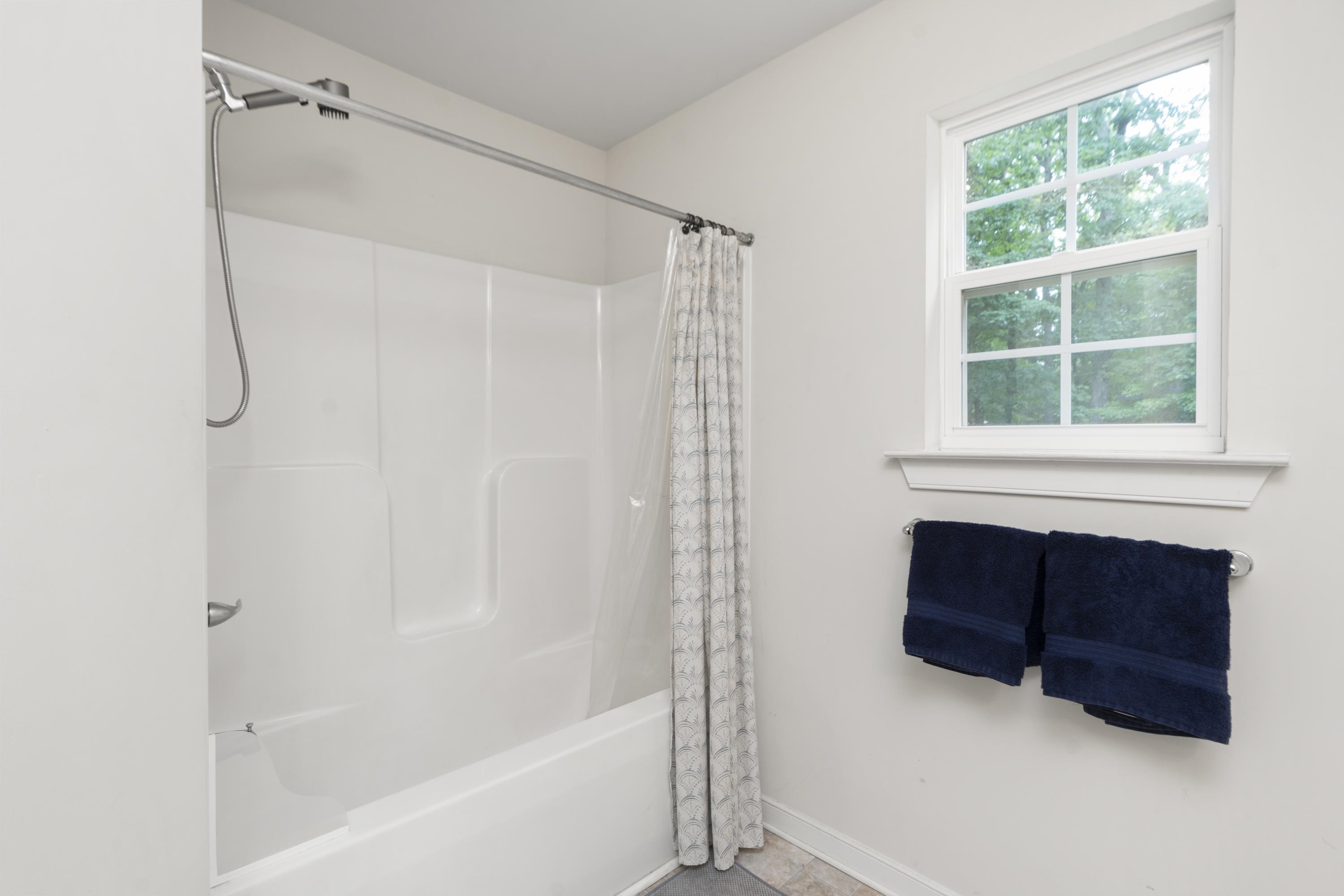 10 Zephyr Road Palmyra, VA 22963 - Photo 37 of 72 a bathroom with a bathtub and a shower