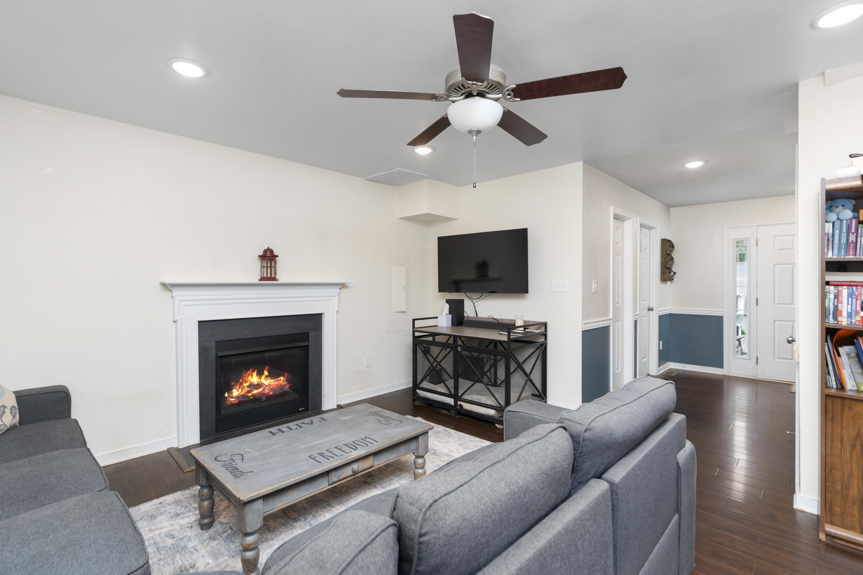 10 Zephyr Road Palmyra, VA 22963 - Photo 10 of 72 a living room with furniture a flat screen tv and a fireplace