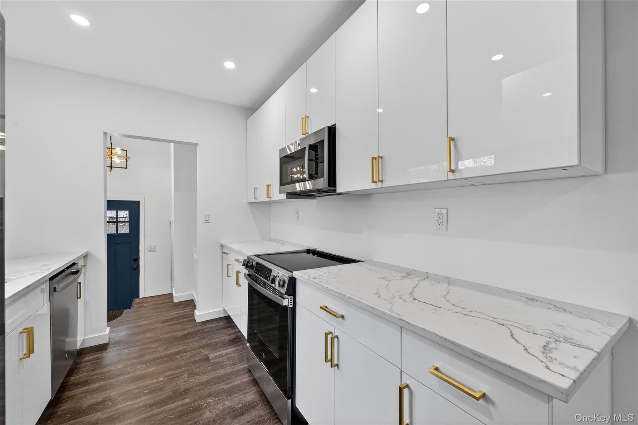 60 Jeanibo Road Monroe, NY 10950 - Photo 2 of 17 a kitchen with stainless steel appliances granite countertop a stove a sink and a microwave
