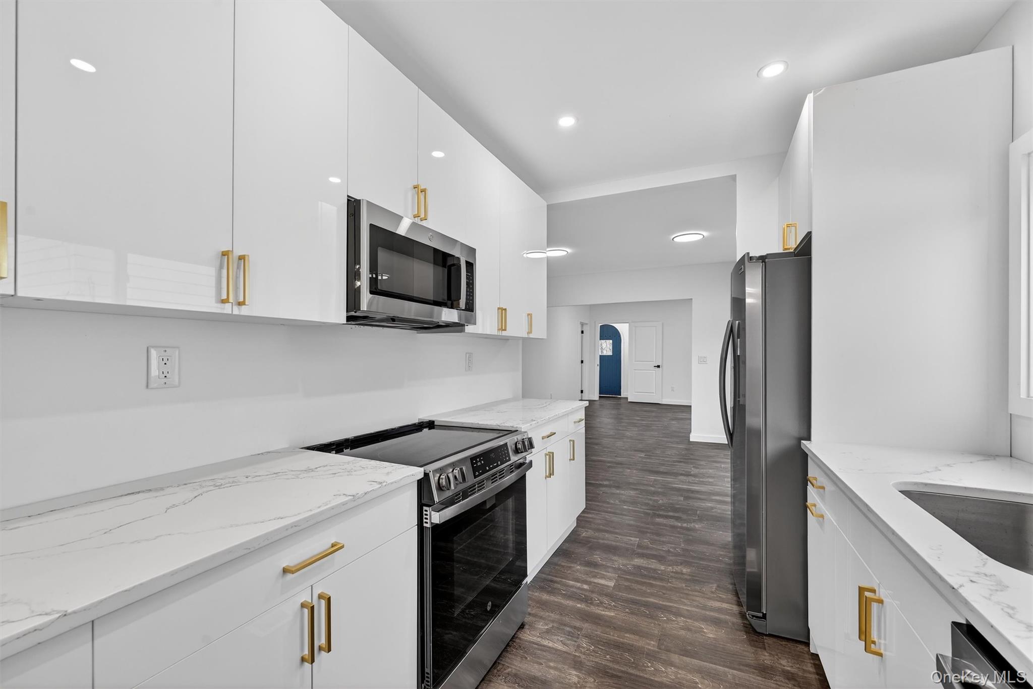 60 Jeanibo Road Monroe, NY 10950 - Photo 4 of 17 a kitchen with a sink a stove and refrigerator