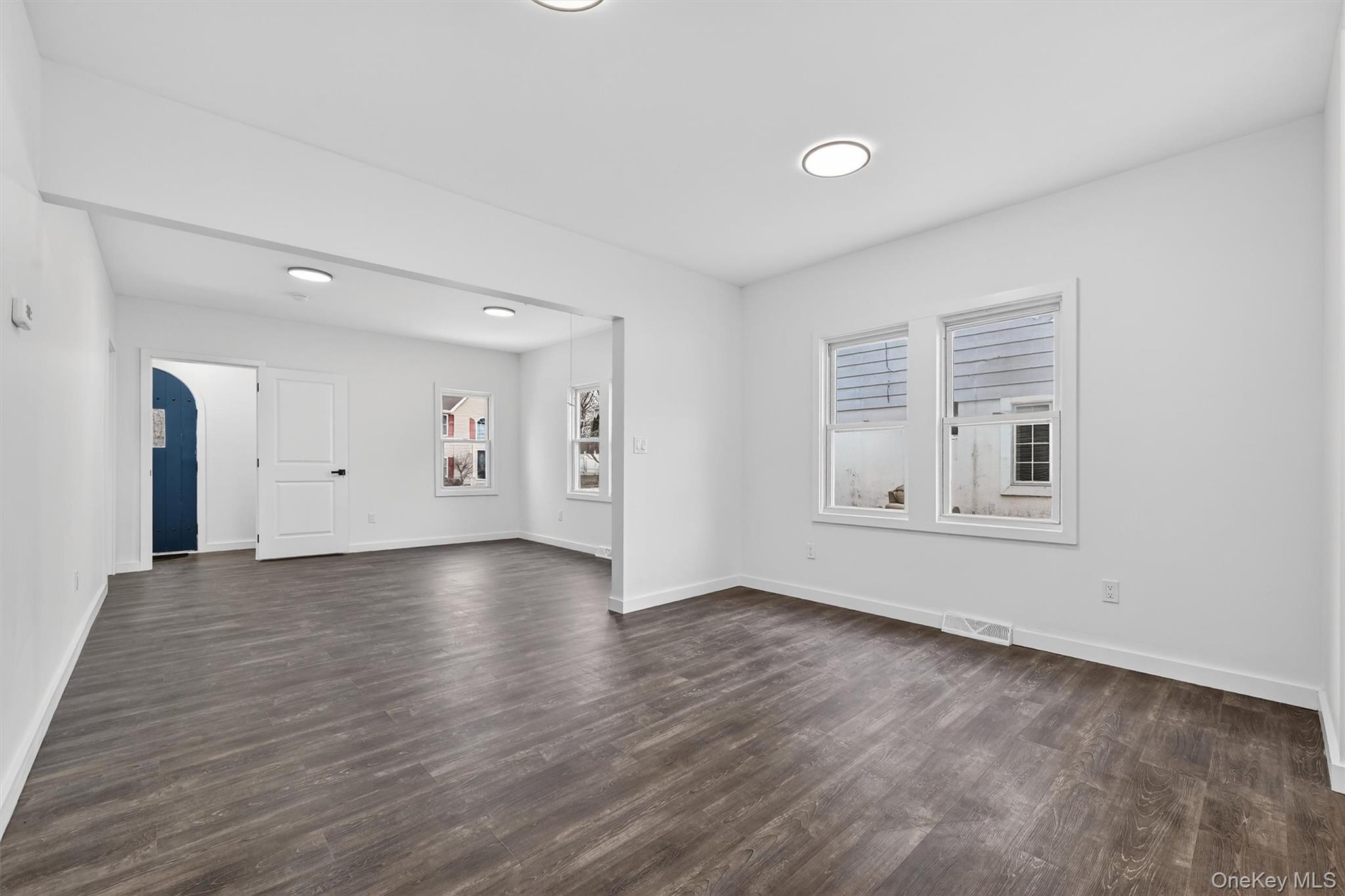 60 Jeanibo Road Monroe, NY 10950 - Photo 5 of 17 a view of an empty room with wooden floor and a window