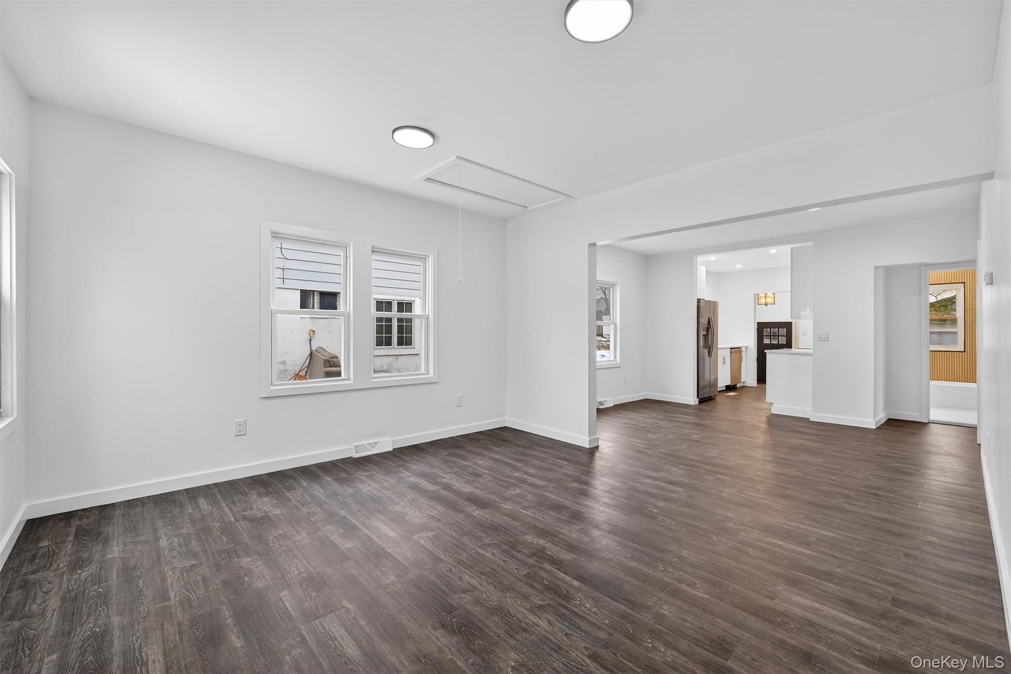 60 Jeanibo Road Monroe, NY 10950 - Photo 6 of 17 a view of an empty room with window and wooden floor