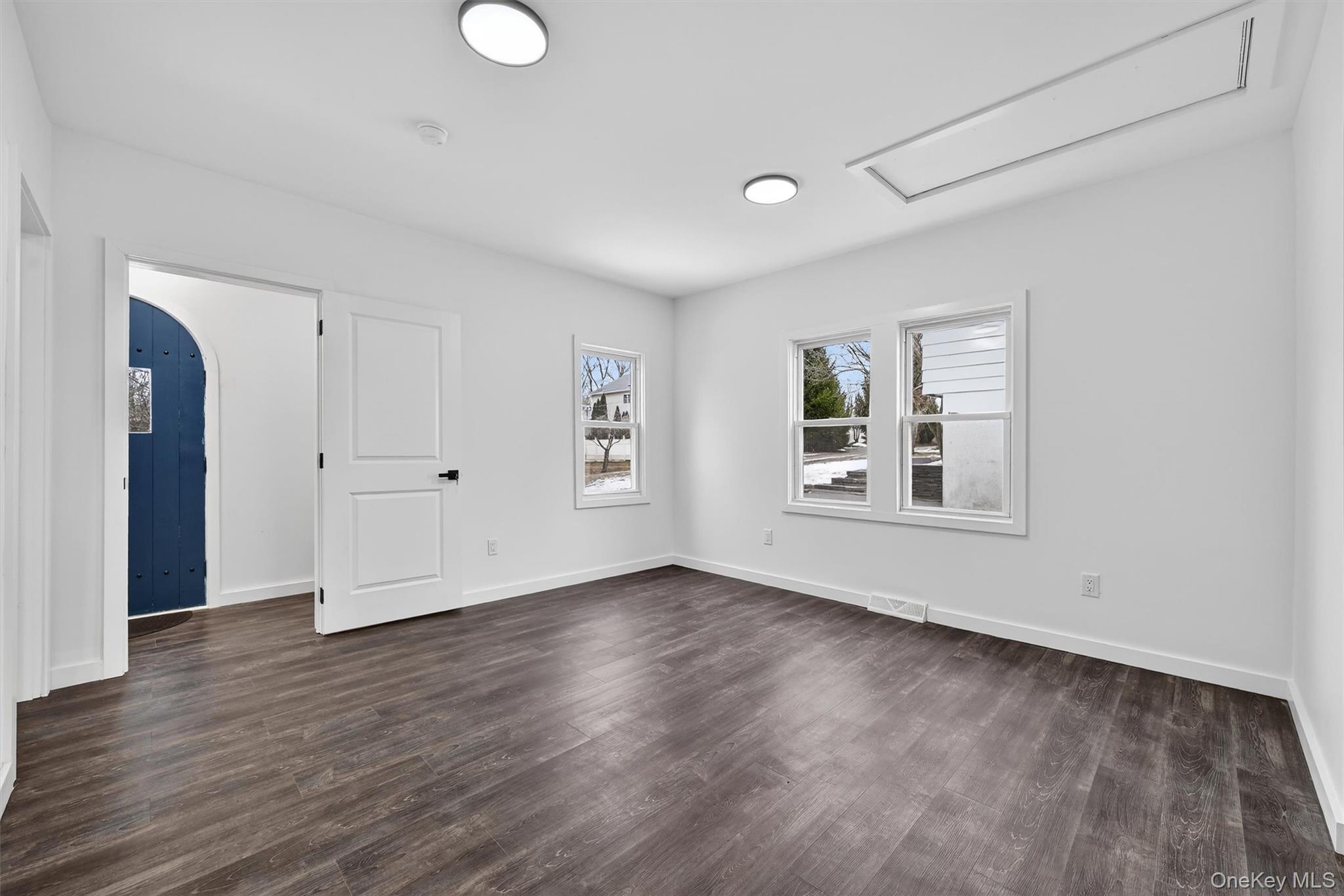 60 Jeanibo Road Monroe, NY 10950 - Photo 8 of 17 an empty room with wooden floor and windows