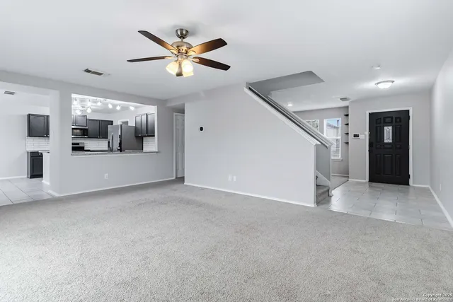a view of a livingroom with a ceiling fan