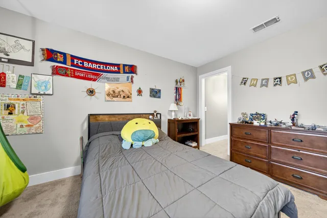 a bedroom with a bed and a cabinets