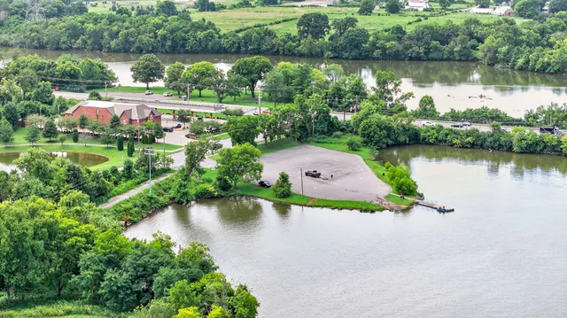 a aerial view of a house with a yard