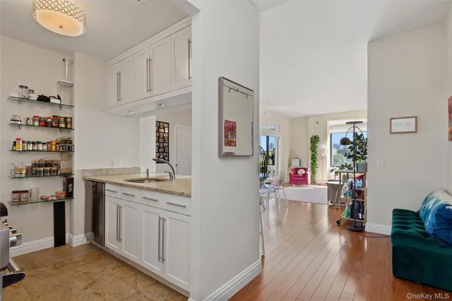a view of living room with furniture and wooden floor