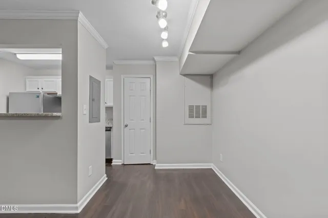 a view of wooden floor and windows in a room