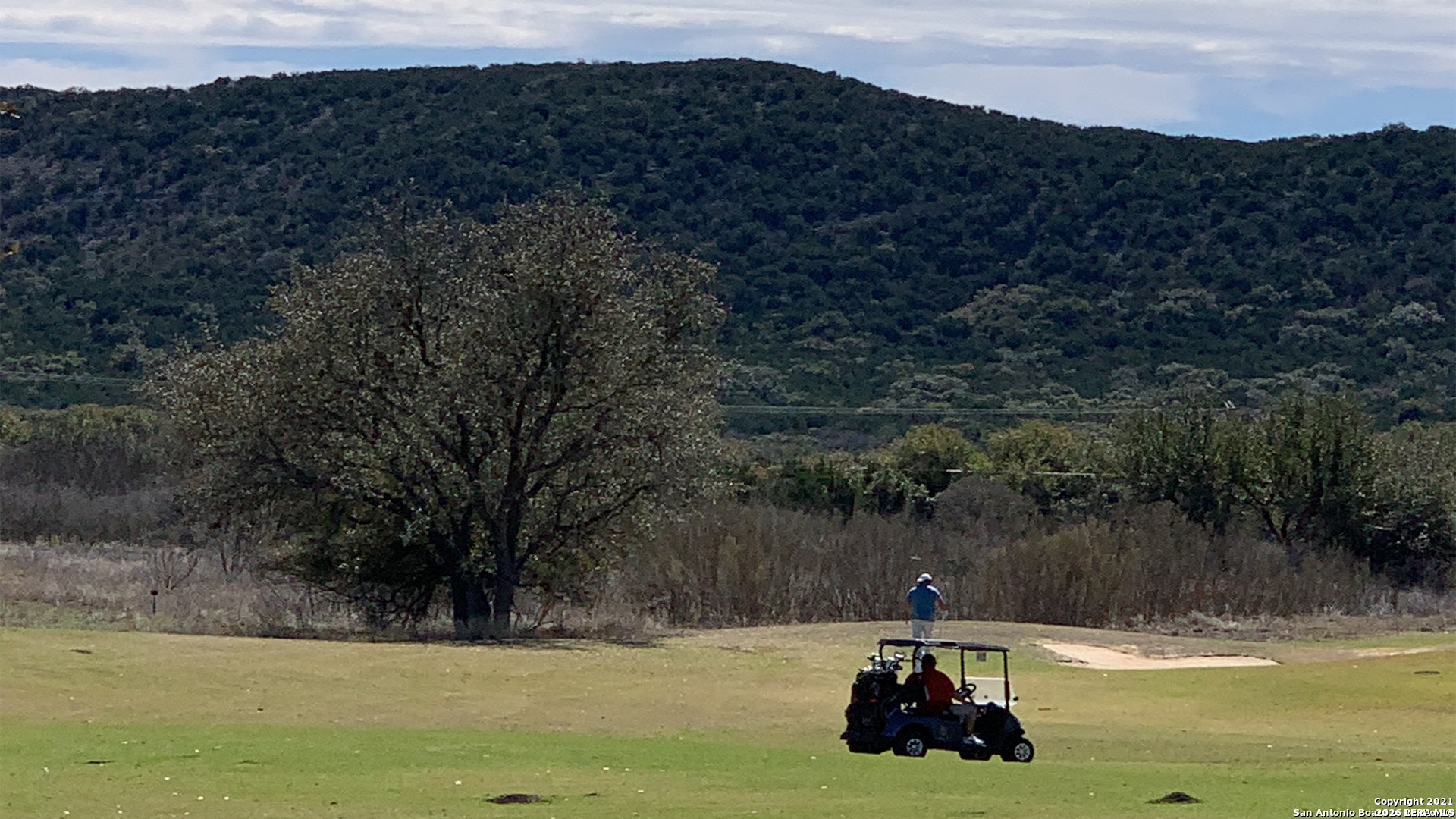 92 Mountain Valley Road Concan, TX 78838 - Photo 2 of 10 a house view with a lake view