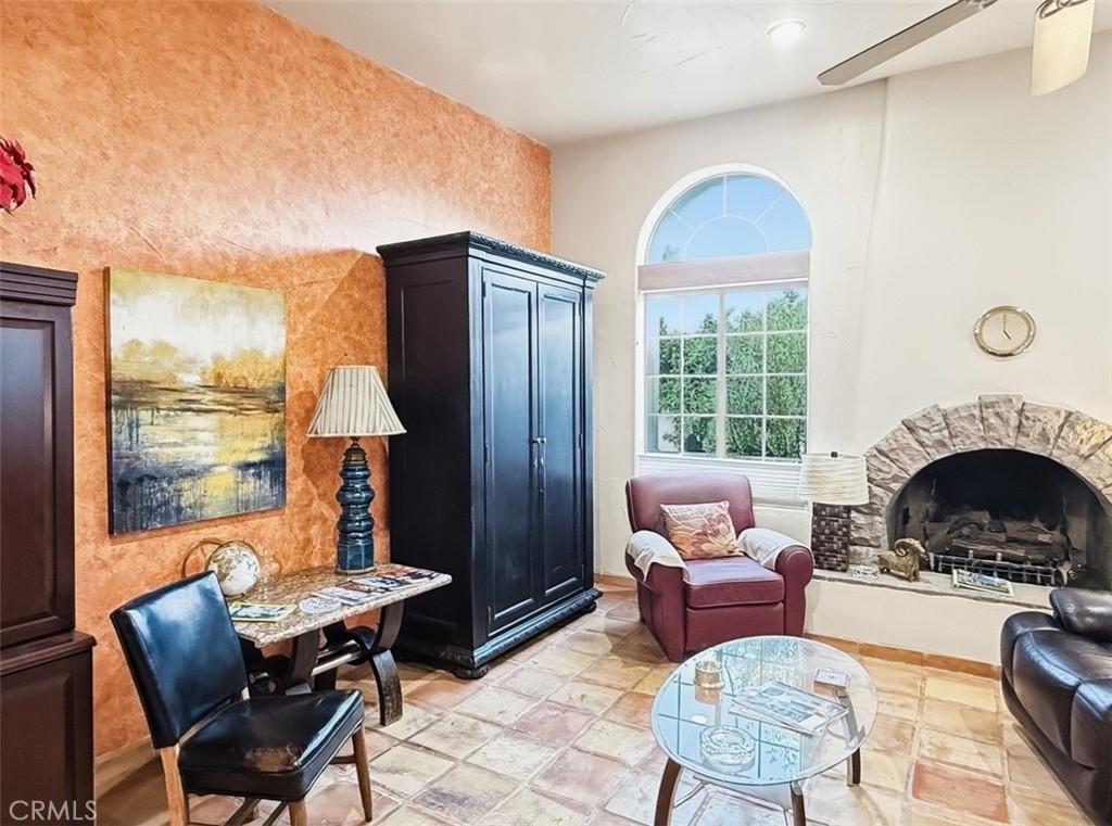 1932 South Barona Road Palm Springs, CA 92264 - Photo 14 of 19 a living room with furniture and a fireplace