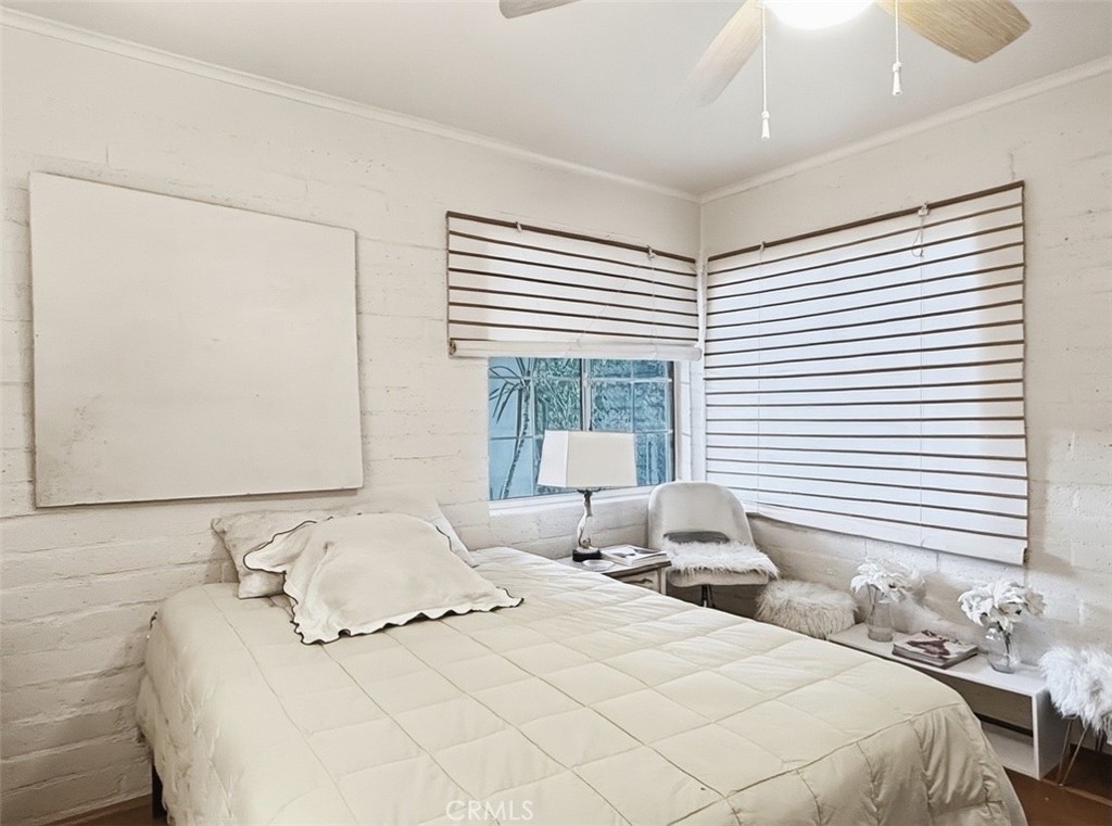 1932 South Barona Road Palm Springs, CA 92264 - Photo 16 of 19 a bedroom with a bed and window