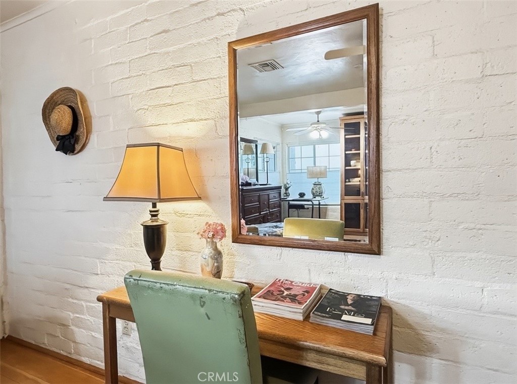 1932 South Barona Road Palm Springs, CA 92264 - Photo 18 of 19 a living room with furniture and a painting on the wall
