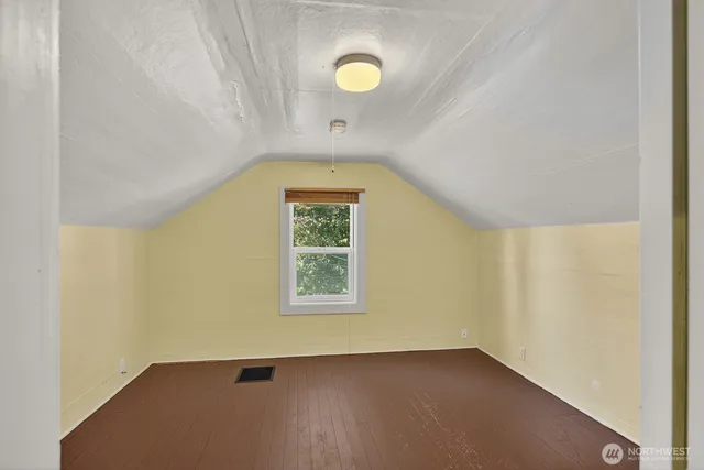 a kitchen with a stove and a refrigerator