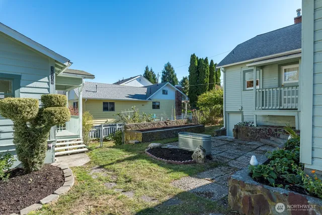 a bathroom with a shower sink vanity and mirror