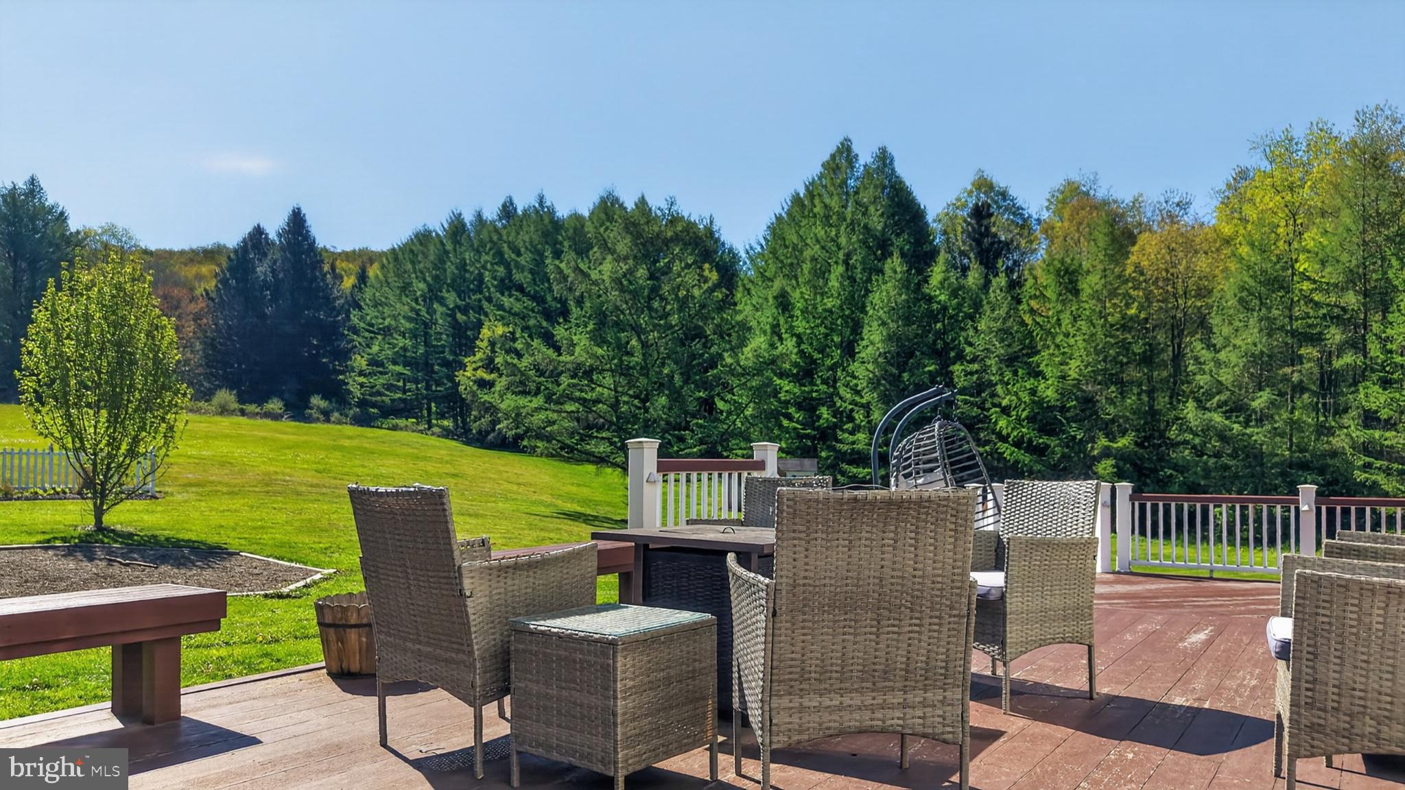 259 A A-Frame Road Coudersport, PA 16915 - Photo 92 of 130 Serene deck with lush green views.