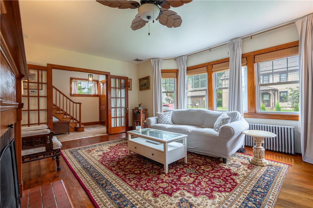 665 Point Phillips Road Bath, PA 18014 - Photo 11 of 73 Rich hardwood floors and a ceiling fan create a comfortable atmosphere in this inviting living area.