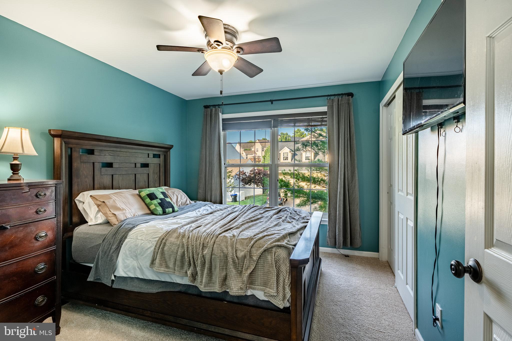 116 Hartman Road Pottstown, PA 19465 - Photo 33 of 49 a bedroom with a large bed and a chandelier