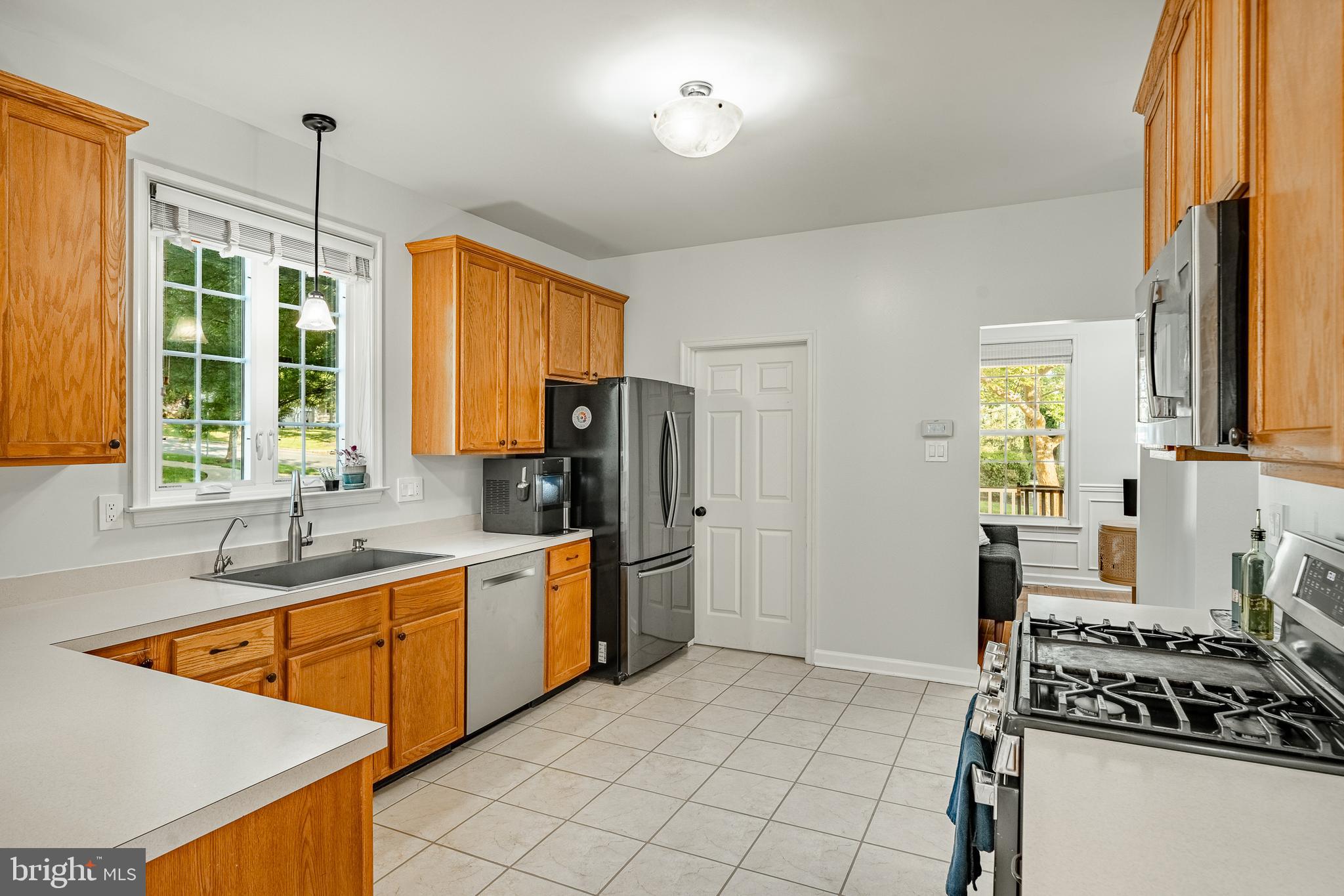 116 Hartman Road Pottstown, PA 19465 - Photo 8 of 49 a kitchen that has a sink stainless steel appliances a window and a counter top space