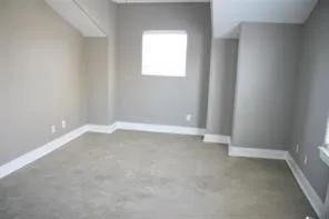a bathroom with a granite countertop sink a toilet a mirror and vanity