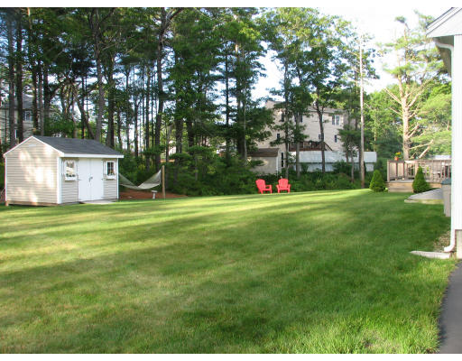 10 Whitecliff Road Bourne, MA 02532 - Photo 3 of 12 a view of a house with a yard and sitting area