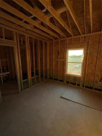 a view of an empty room with wooden walls