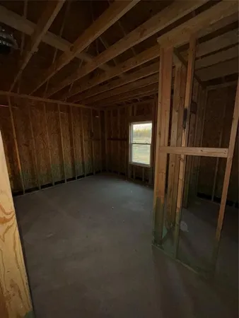 a view of a room with wooden walls