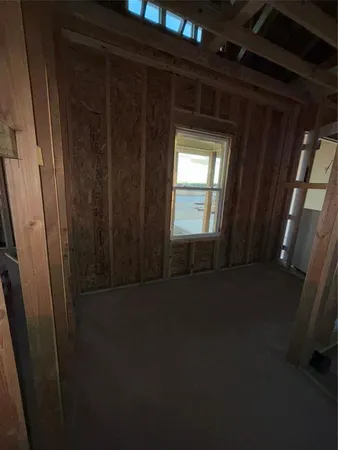 a view of empty room with windows