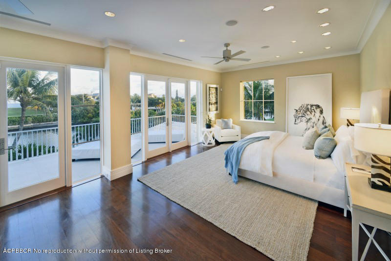 85 Curlew Road Manalapan, FL 33462 - Photo 13 of 30 a bedroom with a large bed and a large window