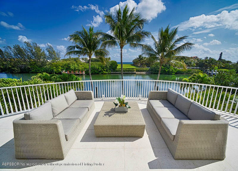 85 Curlew Road Manalapan, FL 33462 - Photo 20 of 30 a balcony with furniture and a potted plant