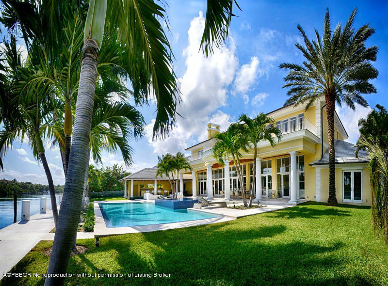 85 Curlew Road Manalapan, FL 33462 - Photo 26 of 30 a front view of a house with swimming pool having outdoor seating