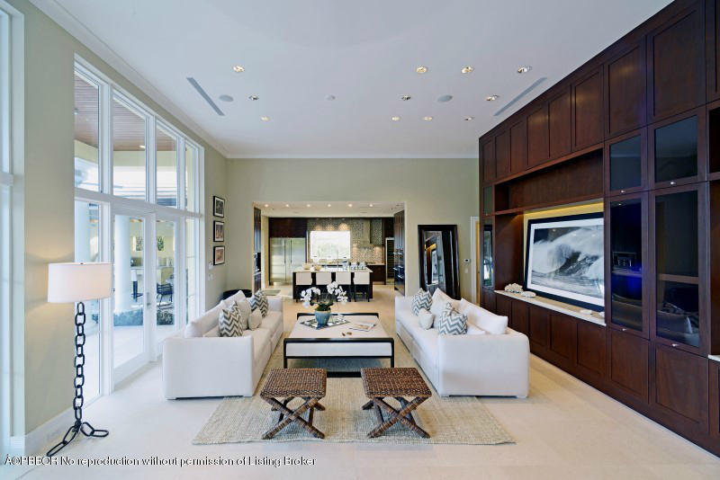 85 Curlew Road Manalapan, FL 33462 - Photo 6 of 30 a living room with furniture flat screen tv and a fireplace