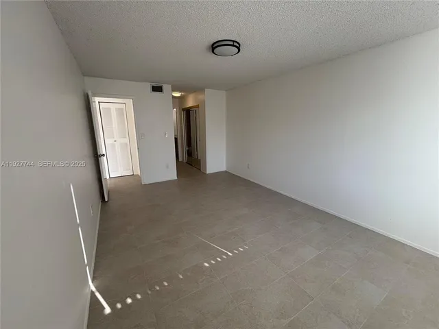 a white toilet sitting next to a bath tub
