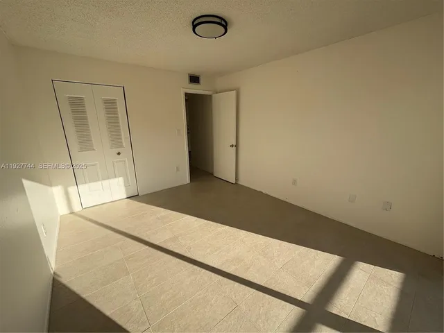 a bedroom with a bed and a table