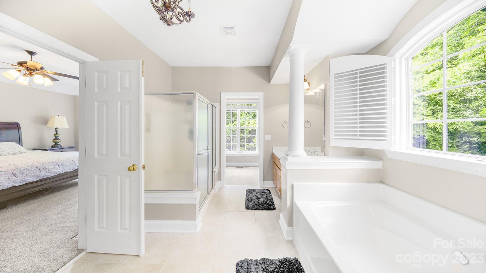 2512 Cornwall Court Northwest Concord, NC 28027 - Photo 22 of 48 a spacious bathroom with a tub shower and a sink