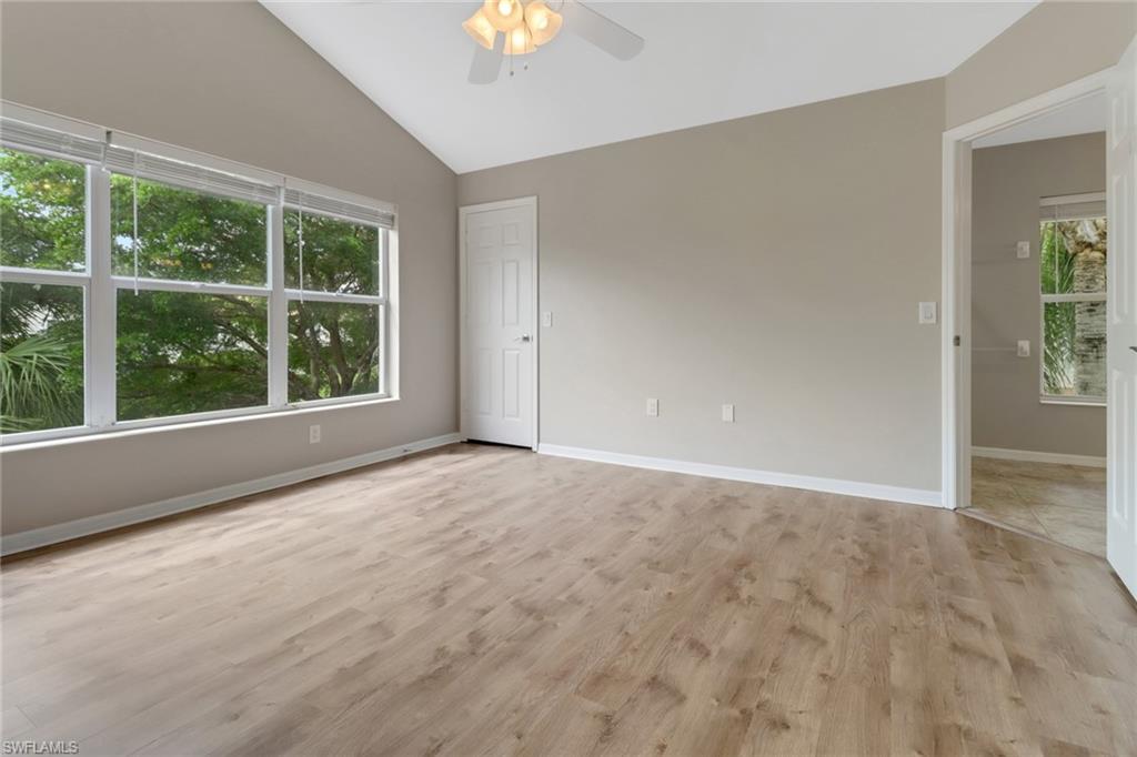 815 Hampton Circle, Unit 143 Naples, FL 34105 - Photo 21 of 30 a view of an empty room with a window
