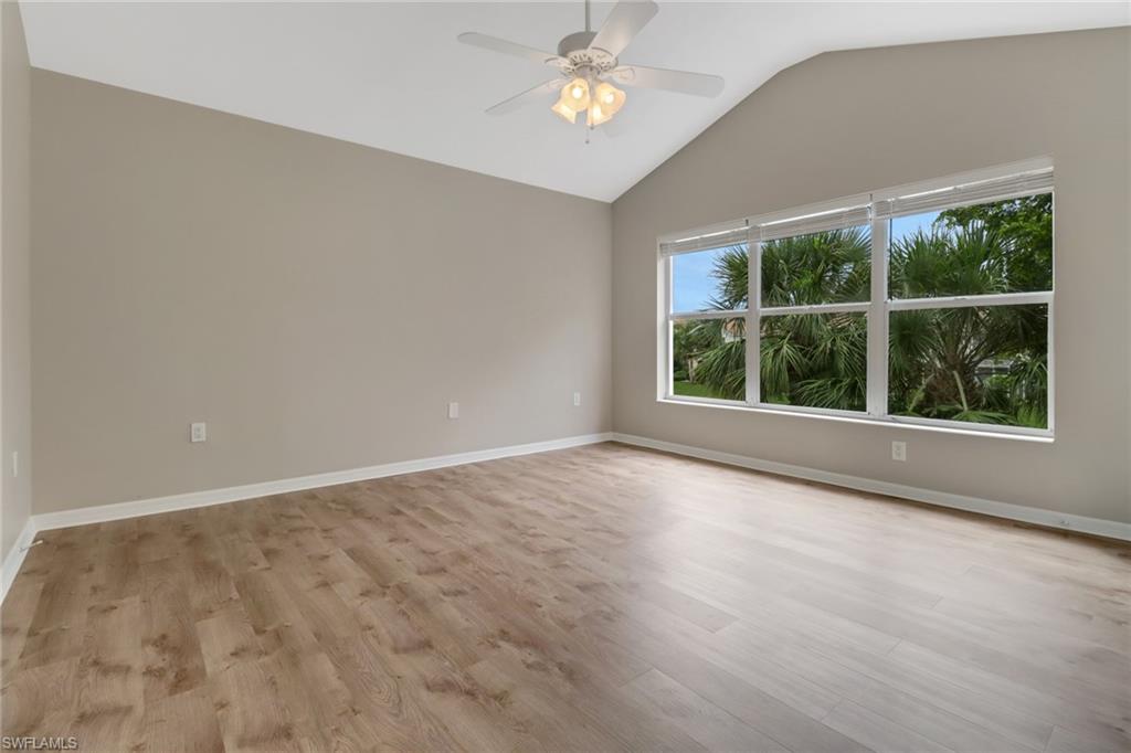 815 Hampton Circle, Unit 143 Naples, FL 34105 - Photo 22 of 30 an empty room with a window